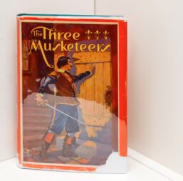 Children's Bookshelf "The Three Musketeers" [c. 1931]  cloth wrapped hardcover Illustrated by Edward Robbins Higgins