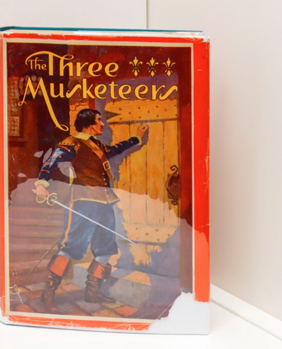 Children’s Bookshelf “The Three Musketeers” [c. 1931]  cloth wrapped hardcover Illustrated by Edward Robbins Higgins