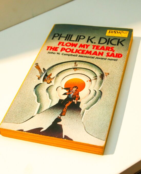c1977 Philip K. Dick novel “Flow My Tears, the Policeman Said” Vintage Daw paperback edition