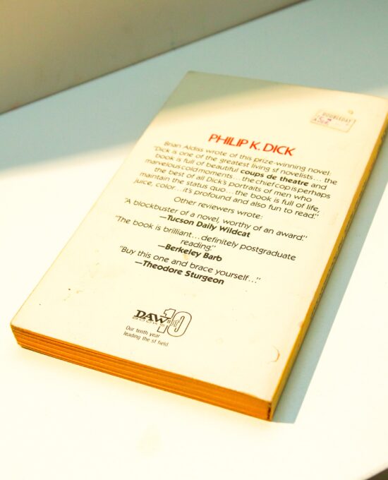 c1977 Philip K. Dick novel “Flow My Tears, the Policeman Said” Vintage Daw paperback edition